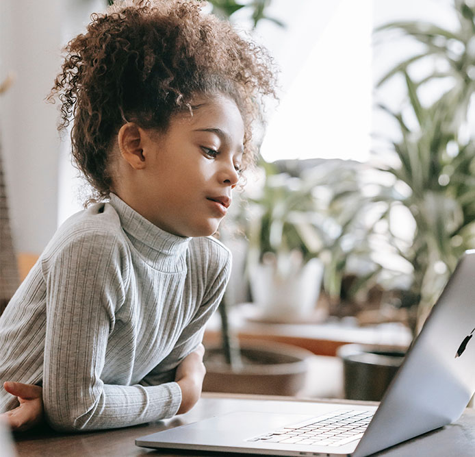 Child looking into a laptop