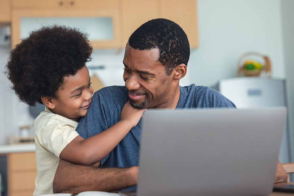 Portrait of African american cute little boy hugging of handsome