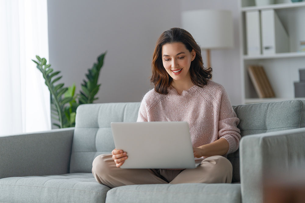 woman using laptop for online doctor appointment