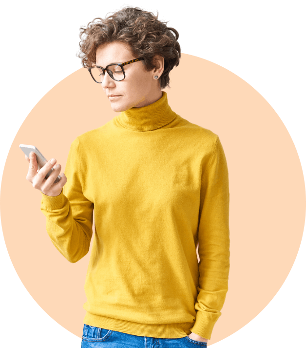 woman in yellow holding phone cmp